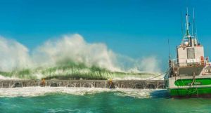 "High Seas Breaking Over the Harbour Wall "