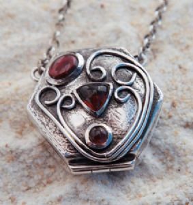 "Silver and garnet locket"