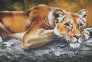 "Lioness Resting on a Tree Trunk"